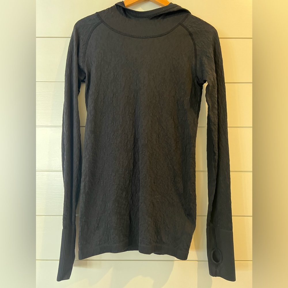 Women’s Lululemon black long sleeved top with hood. Size 8.
